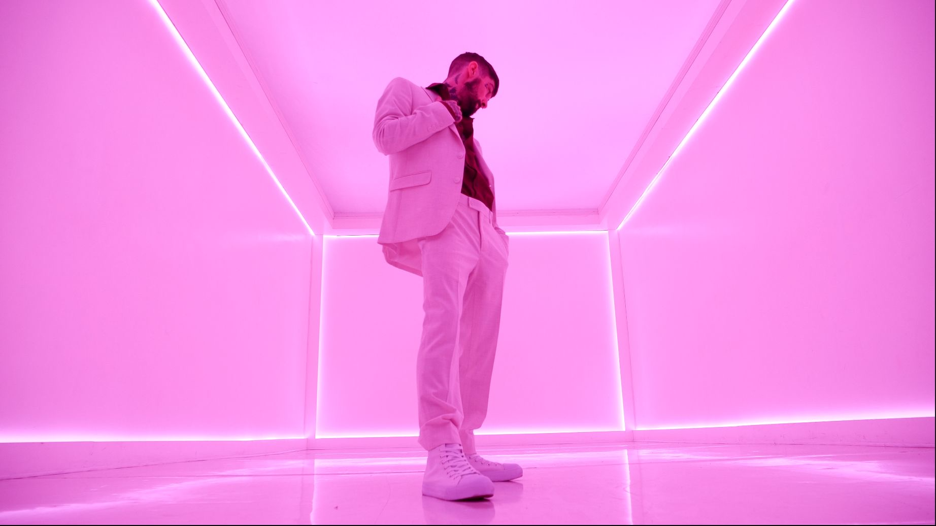Liam Horne in a luminous pink room